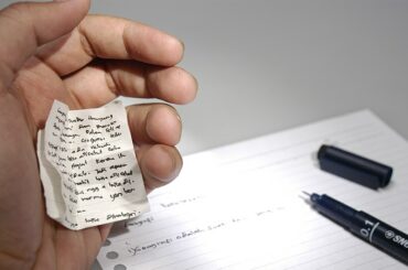 Image used under creative commons from https://en.wikipedia.org/wiki/Cheat_sheet#/media/File:Cheating.JPG